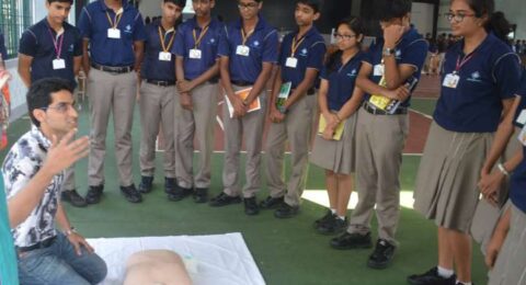 School band or student group standing in uniform during a formal event