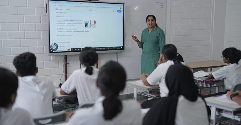 Teacher facilitating inquiry-based learning in an IB classroom at Global Public School